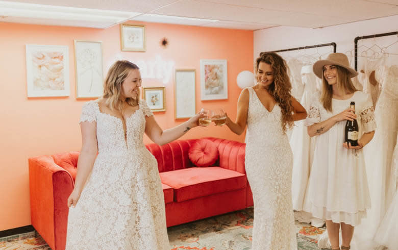 Models wearing a white gowns